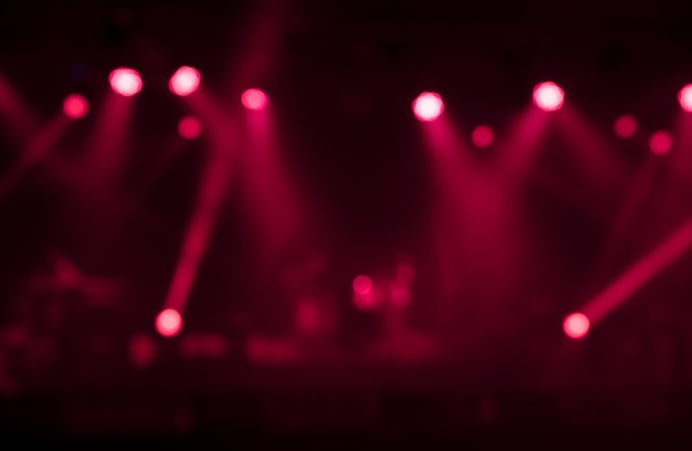 Blurred image background of red stage lights. Party, concert and entertainment concept