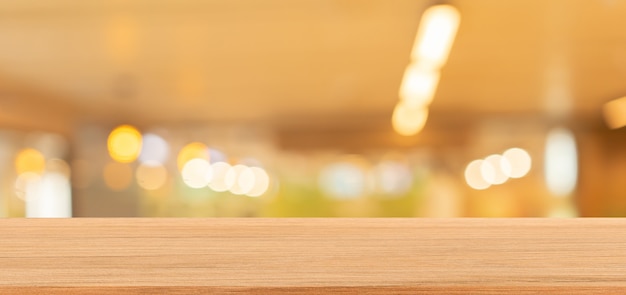 blurred interior of luxury restaurant panoramic background  and vintage wood counter table