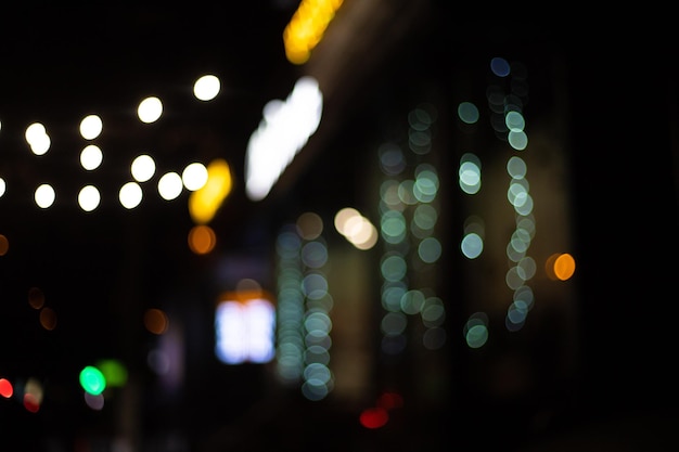 Blurred lights beautiful bokeh on a black background glitter of the night city