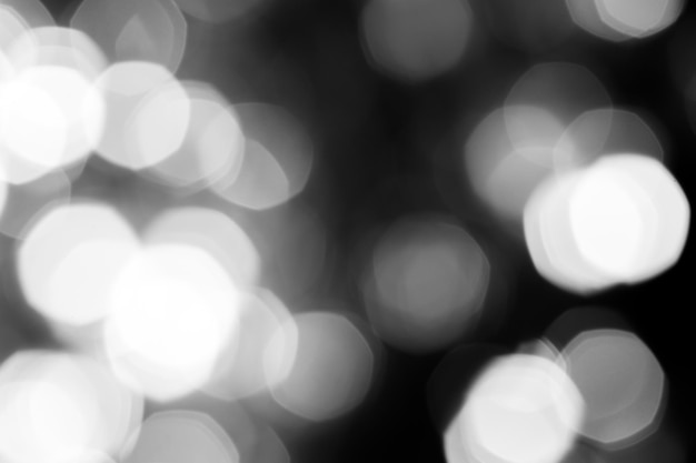 Blurred lights dark gray background Abstract bokeh with soft light Shiny festive christmas texture