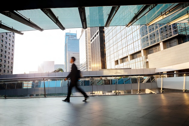 Blurred motion silhouette of businessman walking at Hong Kong walkway