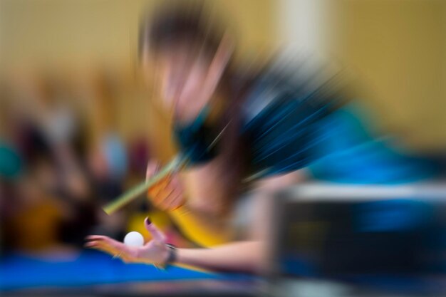 Photo blurred motion woman holding hockey stick while standing in court