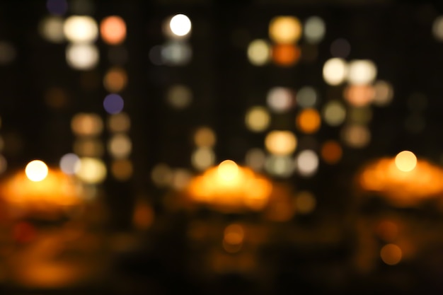 Blurred night city lights photo. Abstract pattern background in bokeh effect.