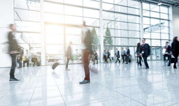 Blurred people walking in a modern hall