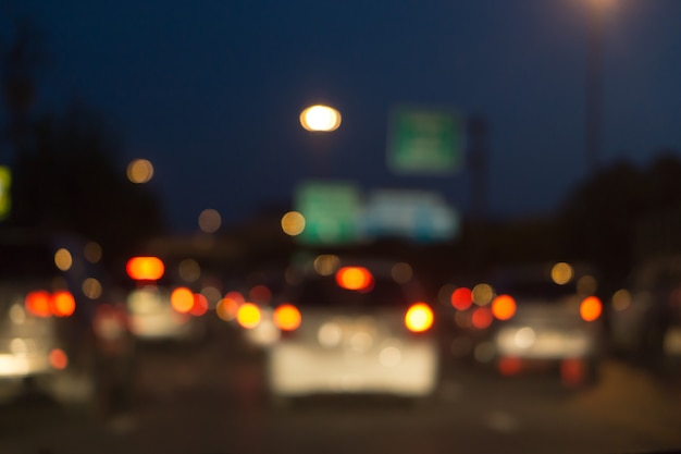 Blurred photo light of traffic car on the city street, abstract blur bokeh background