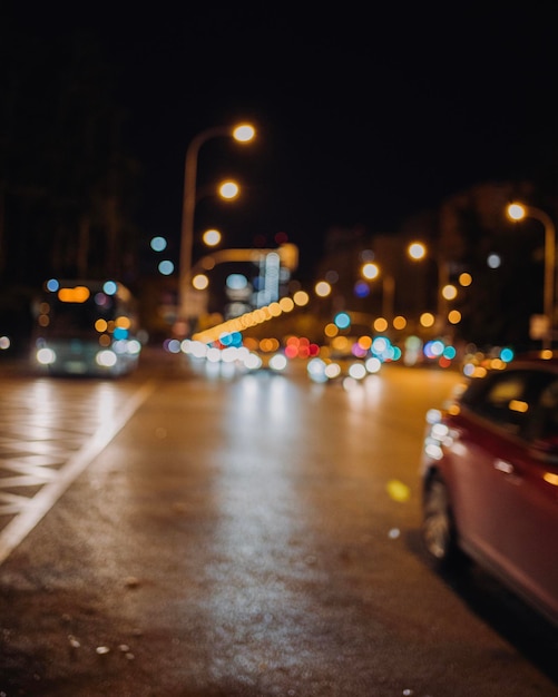 Blurred on purpose Urban traffic lights at night City life concept in Madrid spain