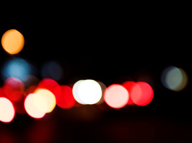 Blurred street bokeh lights at night time