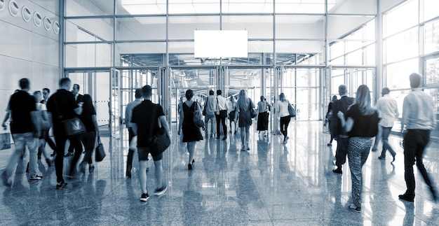 Blurred Trade Show visitors walking to a entrance