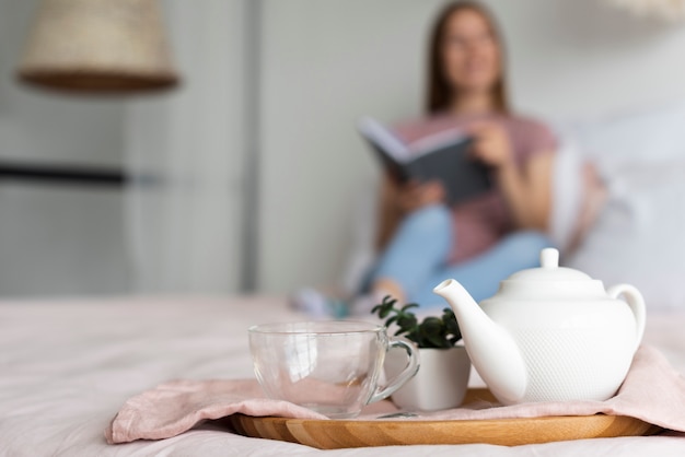 Blurred woman staying on bed