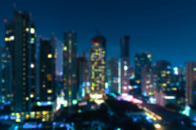 Blurry Bangkok night view with skyscraper in business district in Bangkok Thailand