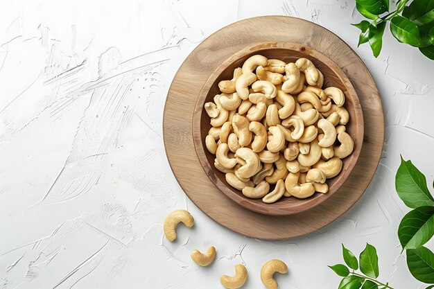 Photo board and plate of tasty cashew with on white background