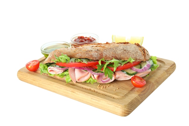 Board with ciabatta sandwich and ingredients isolated on white background