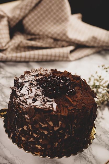 Board with delicious cake on table