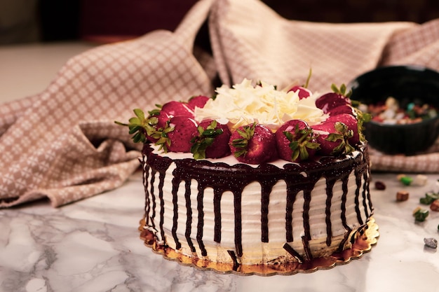 Board with delicious cake on table