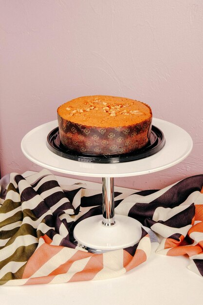 Board with delicious cake on table