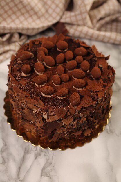 Board with delicious cake on table