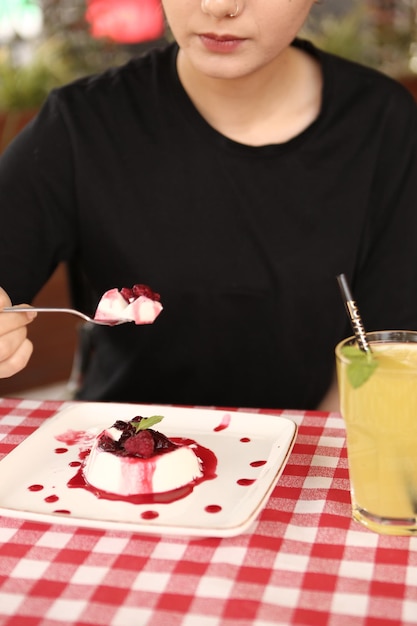 Board with delicious cake on table