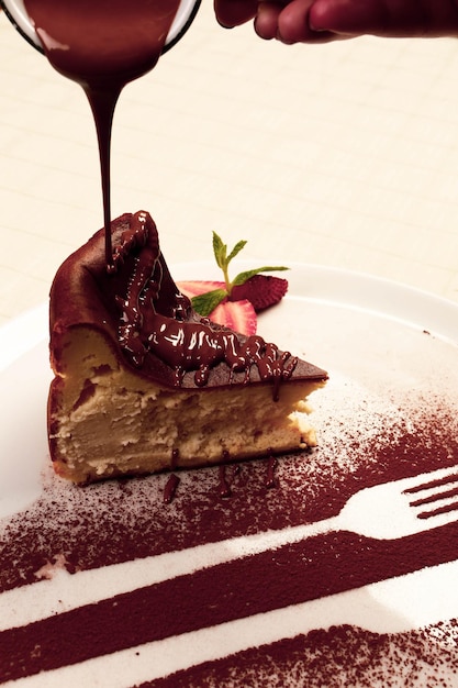 Board with delicious cake on table