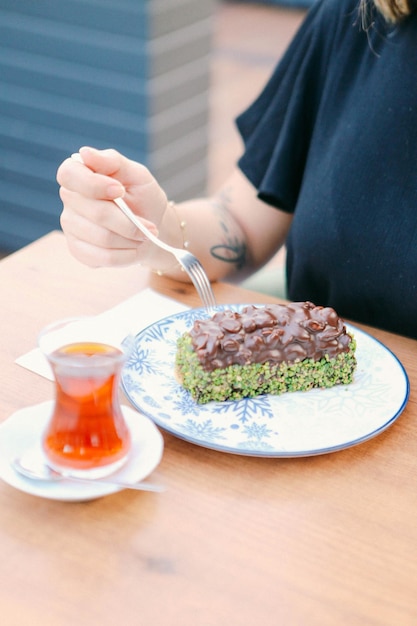 Board with delicious cake on table