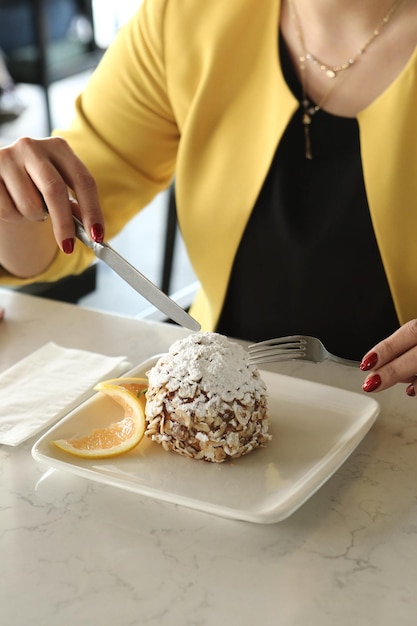 Board with delicious cake on table