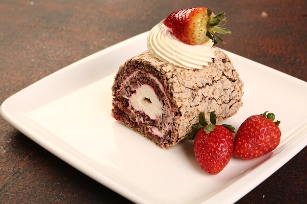 Board with delicious cake on table