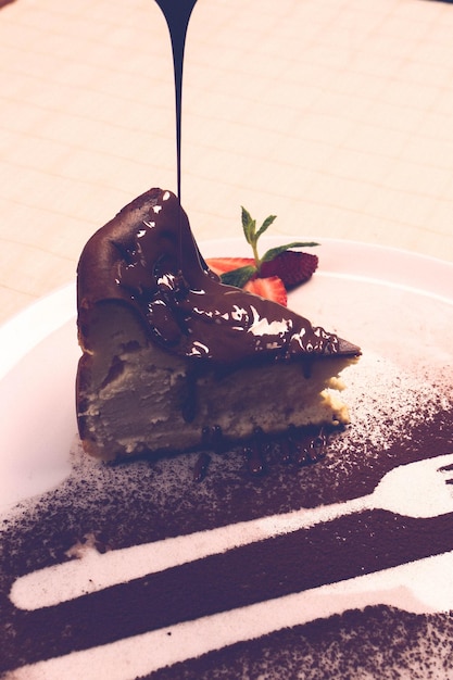 Photo board with delicious cake on table