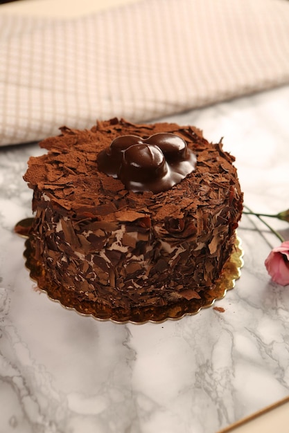 Board with delicious cake on table