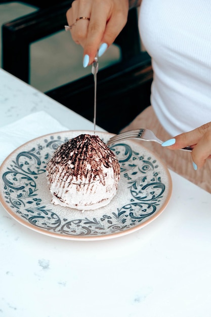 Board with delicious cake on table