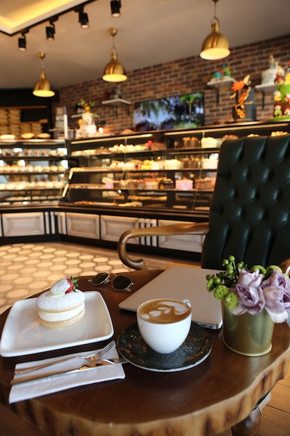 Board with delicious cake on table