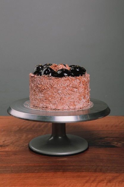 Board with delicious cake on table