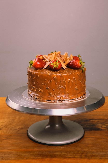 Board with delicious cake on table