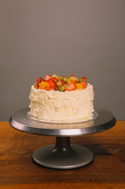 Board with delicious cake on table