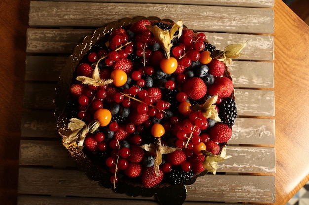 Board with delicious cake on table