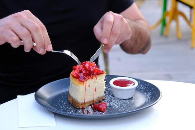 Board with delicious cake on table