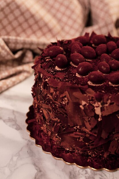 Board with delicious cake on table