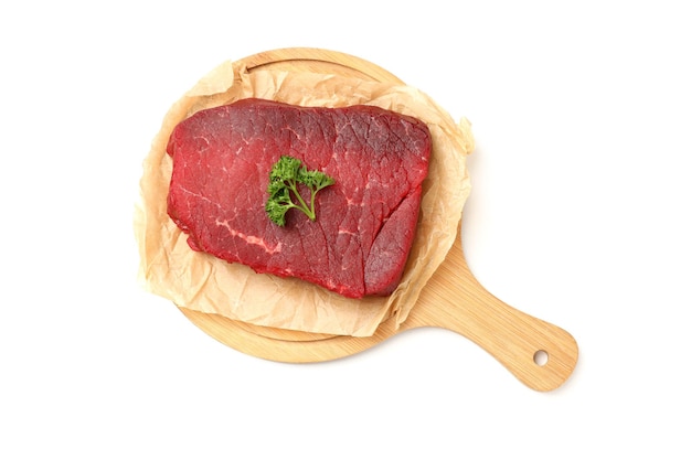 Board with raw beef steak isolated on white background