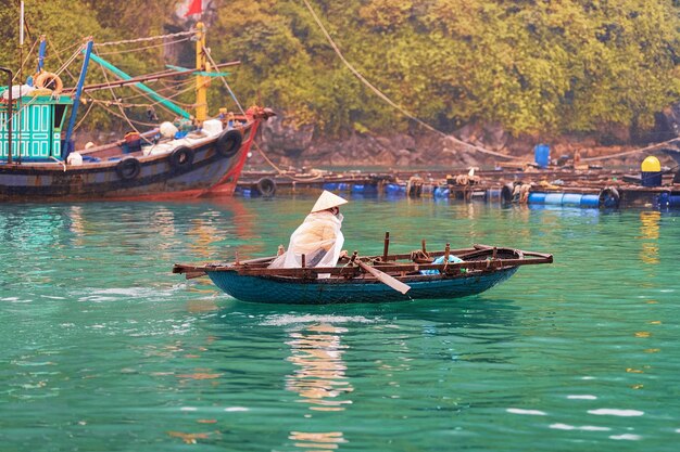 Boat at floating fishing village on Ha Long Bay, Vietnam, Asia