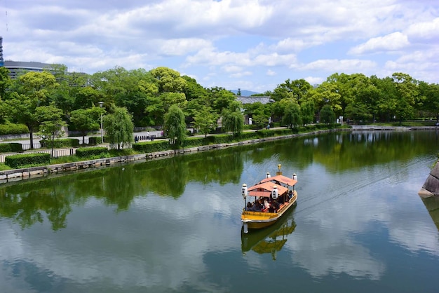 a boat is floating on a lake in Japan