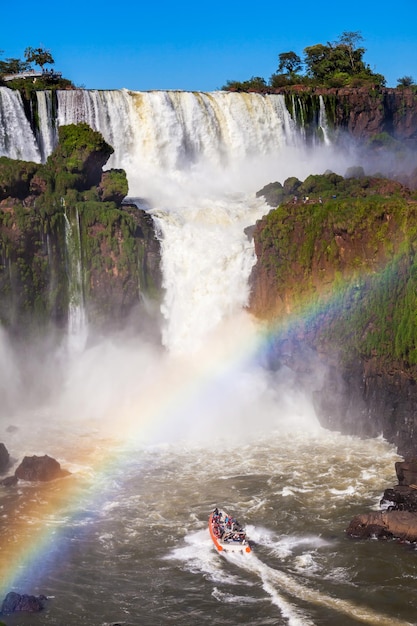 Boat near the Iguazu Falls (Cataratas del Iguazu), waterfalls of the Iguazu River on the border of the Argentina and the Brazil.