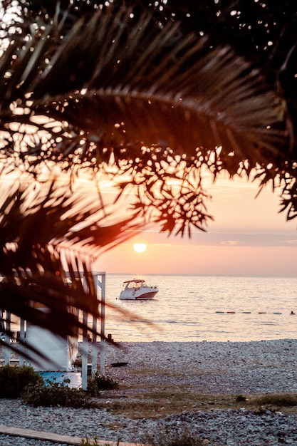 Boat off the coast at sunset