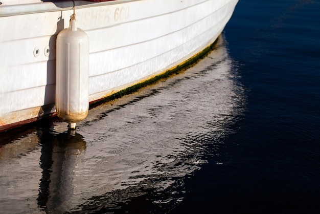 Boat Reflection on the Sea Water Photo