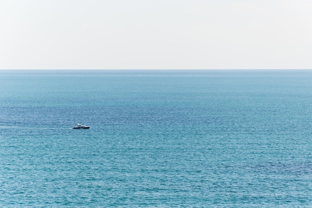 Boat rides in the open blue sea