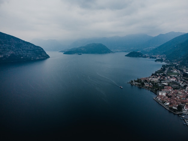 Boat sailing in the sea and mountains landscape