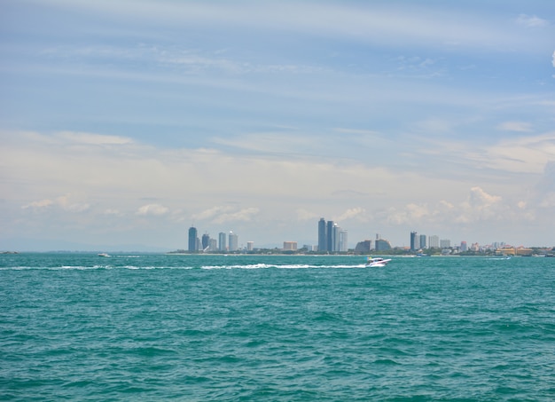 Boat in the sea with cityscape