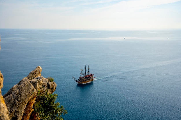 A boat in the sea with a view of the sea and the sky in the background.