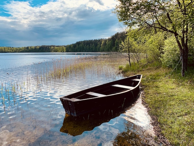 A boat on the water with the word lake on the bottom