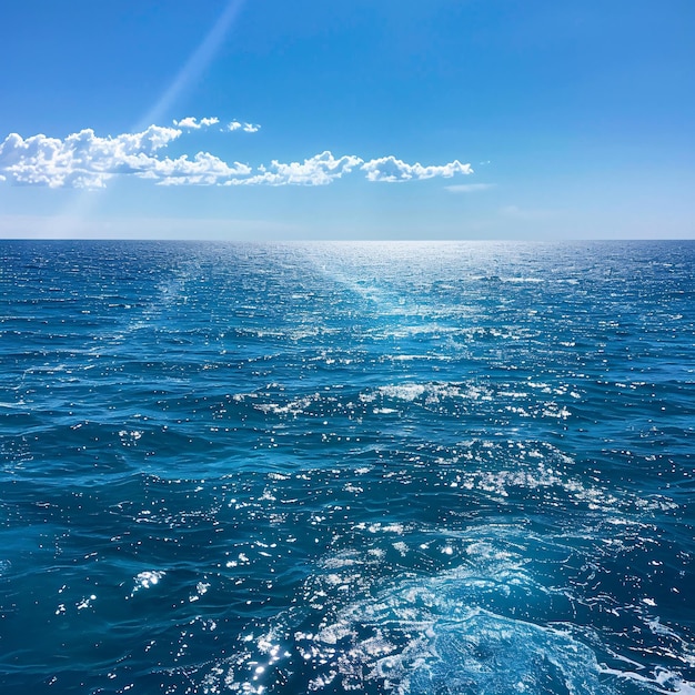 a boat with the sun shining on the water and the sun shining through the clouds