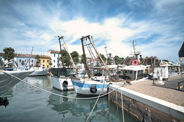 Boats moored near the canal on Rimini harbor