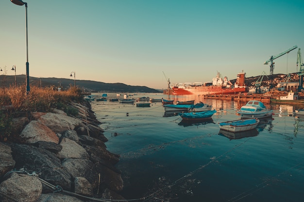 The boats near the cranes