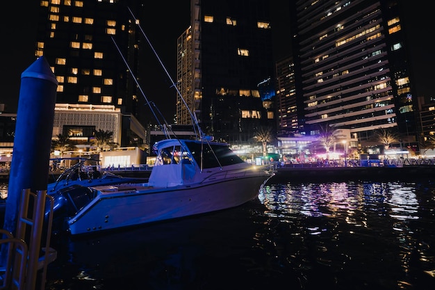 Boats in port at Dubai marina at night in bright lights Marina And Tourist Boat Sightseeing Boat Sailing On Dubai Marina